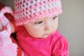 Adorable little baby girl sitting on the floor studio shot lovely portrait