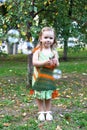 Adorable little blond girl having fun playing with soap bubbles Royalty Free Stock Photo