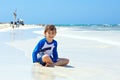 Little blond kid boy having fun on tropical beach of Jamaica Royalty Free Stock Photo