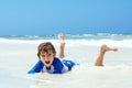 Little blond kid boy having fun on tropical beach of Maldives Royalty Free Stock Photo