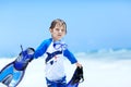 Adorable little blond kid boy having fun on tropical beach of Maldives. Excited child playing and surfing in sun Royalty Free Stock Photo