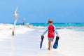 Little blond kid boy having fun on tropical beach of Maldives Royalty Free Stock Photo