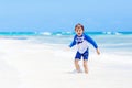 Little blond kid boy having fun on tropical beach of Maldives Royalty Free Stock Photo