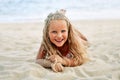 Adorable little blonde girl relax on sandy beach enjoy sea Royalty Free Stock Photo