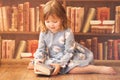 Adorable little bookworm girl reading books Royalty Free Stock Photo