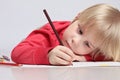 Adorable little boy drawing picture, close up portrait. Kid with pencils Royalty Free Stock Photo