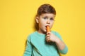 Adorable little boy eating carrot Royalty Free Stock Photo