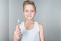 adorable little boy holding toothbrush and smiling Royalty Free Stock Photo
