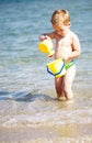 Adorable little boy playing in the sea Royalty Free Stock Photo