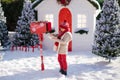 Adorable little boy with red hat and green glasses sending her letter to Santa, Christmas time Royalty Free Stock Photo