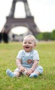 Adorable little boy sitting on the grass Royalty Free Stock Photo
