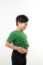Adorable little boy suffering from abdominal pain, copy space. Young boy having stomachache