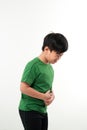 Adorable little boy suffering from abdominal pain, copy space. Young boy having stomachache Royalty Free Stock Photo