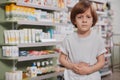 Little sick boy at the pharmacy Royalty Free Stock Photo