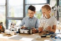 Adorable little boys examining new robots Royalty Free Stock Photo