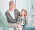 Adorable little caucasian girl sitting and bonding with her beautiful mother in the living room at home. Happy young Royalty Free Stock Photo