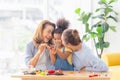 Adorable little child mould from plasticine with mother and grandmother, Grandmother and grandchildren playing cheerfully in