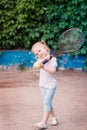 Adorable little child playing tennis Royalty Free Stock Photo