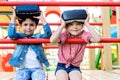adorable little children taking off virtual reality headsets Royalty Free Stock Photo