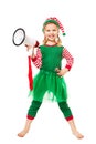 Adorable Little Christmas Elf Girl holding Megaphone.  Happy Smiling Child in Masquerade Costume. Christmas Advert and Sale Royalty Free Stock Photo