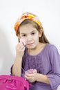 Adorable little girl applying make-up with powder Royalty Free Stock Photo