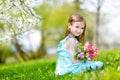 Adorable little girl in blooming cherry garden Royalty Free Stock Photo