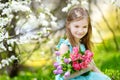 Adorable little girl in blooming cherry garden Royalty Free Stock Photo