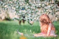 Adorable little girl in blooming cherry tree garden on spring day Royalty Free Stock Photo