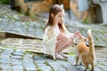 Adorable little girl and a cat