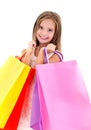 Adorable little girl child holding shopping colorful paper bags Royalty Free Stock Photo