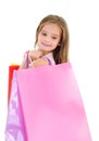 Adorable little girl child holding shopping colorful paper bags Royalty Free Stock Photo