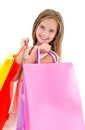 Adorable little girl child holding shopping colorful paper bags Royalty Free Stock Photo