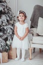 Adorable Little Girl in Christmas Decorated Studio