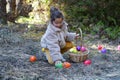 Adorable little girl collecting Easter eggs Royalty Free Stock Photo