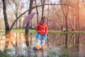 Little girl in gumboots in puddle Royalty Free Stock Photo
