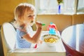 Adorable little girl eating pasta at home Royalty Free Stock Photo