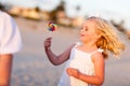 Adorable Little Girl Enjoying Her Lollipop Outside Royalty Free Stock Photo