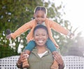 If shes happy, Im happy. an adorable little girl enjoying a piggyback ride with her mother in a garden. Royalty Free Stock Photo