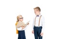 adorable little girl in eyeglasses reading book and looking at boy Royalty Free Stock Photo