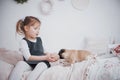 Adorable little girl feeding cute pug. She bought a puppy. the best friend Royalty Free Stock Photo