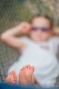 Adorable little girl in hammock outdoor at the beach