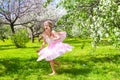 Adorable little girl have fun in blossoming apple Royalty Free Stock Photo