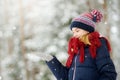 Adorable little girl having fun in beautiful winter park. Cute child playing in a snow. Royalty Free Stock Photo