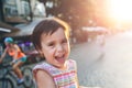 Adorable little girl having fun in a city