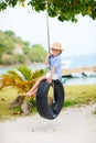 Little girl on tire swing Royalty Free Stock Photo