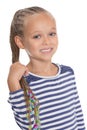 Adorable little girl holding dreadlocks