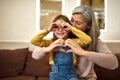Lovely girl and grandmother having fun together Royalty Free Stock Photo