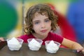 Adorable little girl holding three ice cream Royalty Free Stock Photo