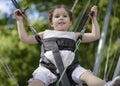 Adorable little girl jumping on the trampoline Royalty Free Stock Photo