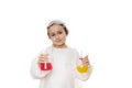 Adorable little girl in lab coat, posing with laboratory flasks with colorful chemical solutions on white background